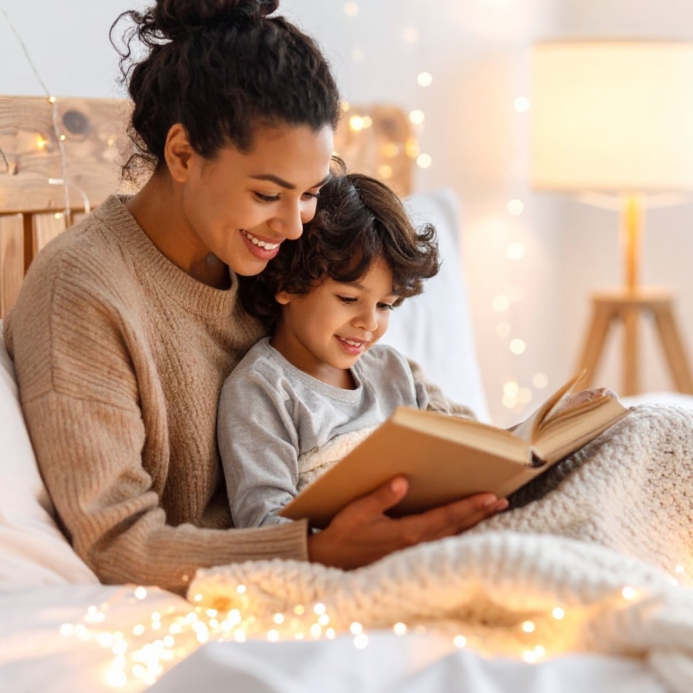 Parent and child reading together in soft light, reflecting astrology-based parenting and understanding a child’s temperament Parent and child reading together in soft light, reflecting astrology-based parenting and understanding a child’s temperament