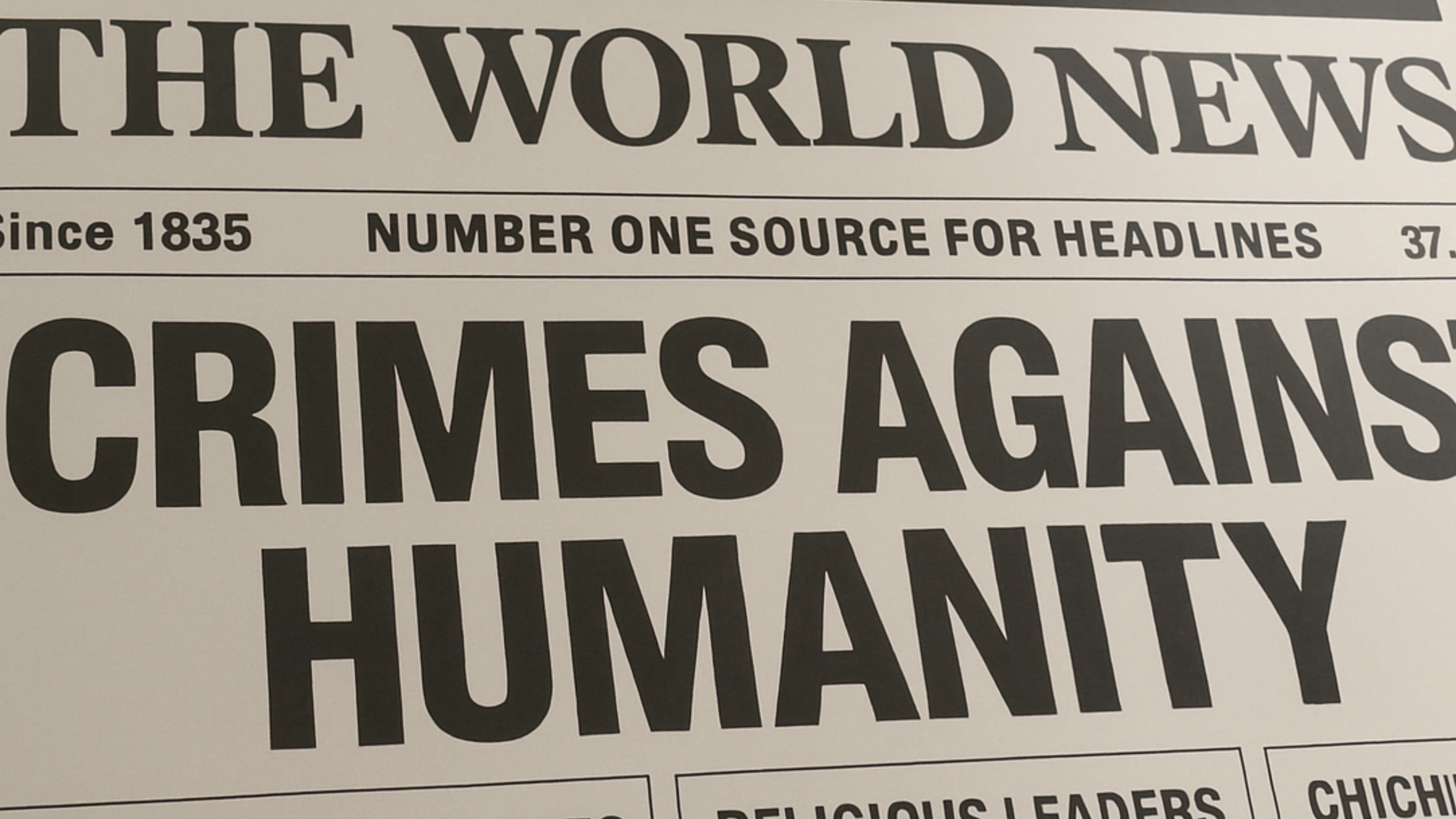 Newspaper headline reading “CRIMES AGAINST HUMANITY” featured in an Earth Siren article about reacting to headlines through birth chart houses